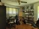 Home office featuring a workspace, bookshelves, and window at 3321 S Norcross Tucker Rd, Tucker, GA 30084