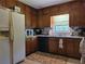 Kitchen with wood cabinets, appliances, and window at 3321 S Norcross Tucker Rd, Tucker, GA 30084