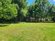 Spacious backyard with lush grass and a detached shed at 3321 S Norcross Tucker Rd, Tucker, GA 30084