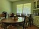 Dining room with wood table, chairs, and built-in hutch at 3321 S Norcross Tucker Rd, Tucker, GA 30084