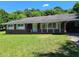 Brick ranch house with a carport and lawn at 3321 S Norcross Tucker Rd, Tucker, GA 30084