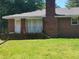 Brick home exterior showcasing a side entrance and steps at 3321 S Norcross Tucker Rd, Tucker, GA 30084