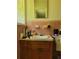 Bathroom with pink tile, vanity, and a mirror at 3321 S Norcross Tucker Rd, Tucker, GA 30084