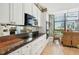 Modern kitchen with white cabinets, granite counters, and breakfast area at 750 Park Ne Ave # 6S, Atlanta, GA 30326
