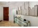 Elegant apartment entryway with glass console table and city skyline mirror at 750 Park Ne Ave # 6S, Atlanta, GA 30326
