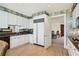 Modern kitchen with white cabinets, granite counters, and breakfast area at 750 Park Ne Ave # 6S, Atlanta, GA 30326
