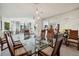 Spacious dining room with glass table, modern chairs, and city views at 750 Park Ne Ave # 6S, Atlanta, GA 30326