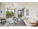 Living room with white sofas, glass tables, and floor-to-ceiling windows at 750 Park Ne Ave # 6S, Atlanta, GA 30326