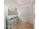 Elegant apartment entryway with glass console table and city skyline mirror at 750 Park Ne Ave # 6S, Atlanta, GA 30326