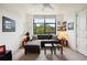 Living area with sectional sofa, city views, and ample natural light at 750 Park Ne Ave # 6S, Atlanta, GA 30326