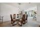 Modern glass dining table with mid-century modern chairs at 750 Park Ne Ave # 6S, Atlanta, GA 30326