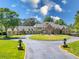 Stunning two-story home with stone accents and manicured lawn at 10955 Stroup Rd, Roswell, GA 30075