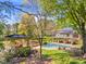 Resort-style pool and gazebo in a lush backyard setting at 10955 Stroup Rd, Roswell, GA 30075