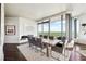 Modern dining room with large table and city views at 3344 Peachtree Ne Rd # 3902, Atlanta, GA 30326