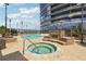Inviting pool and hot tub area with fireplace and lounge chairs at 3344 Peachtree Ne Rd # 3902, Atlanta, GA 30326