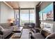 Luxury living room with fireplace, large TV, and city views at 3344 Peachtree Ne Rd # 3902, Atlanta, GA 30326