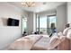 Bright bedroom featuring a comfortable bed and balcony access at 3344 Peachtree Ne Rd # 3902, Atlanta, GA 30326