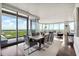 Open dining area with a large wooden table and city view at 3344 Peachtree Ne Rd # 3902, Atlanta, GA 30326