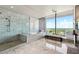 Spa-like bathroom with marble tile and a soaking tub at 3344 Peachtree Ne Rd # 3902, Atlanta, GA 30326