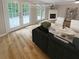 Virtually staged living room with fireplace and deck access at 3316 Merlot Pass, Lawrenceville, GA 30044