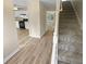 Light-filled entryway with kitchen and staircase views at 3316 Merlot Pass, Lawrenceville, GA 30044