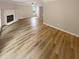 Large living room featuring hardwood floors and fireplace at 3316 Merlot Pass, Lawrenceville, GA 30044
