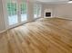 Living room with hardwood floors and access to deck at 3316 Merlot Pass, Lawrenceville, GA 30044