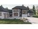 Modern two-story home with stone and gray siding at 1527 Adora Ln, Duluth, GA 30097