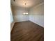 Formal dining room with hardwood floors and wainscoting at 2270 Highridge Point Dr, Lithia Springs, GA 30122
