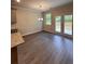 Bright dining room with hardwood floors and sliding glass doors to patio at 2270 Highridge Point Dr, Lithia Springs, GA 30122