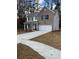 Two-story house with gray brick, white garage door, and landscaping at 2270 Highridge Point Dr, Lithia Springs, GA 30122