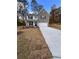 Two-story house with gray brick, white garage door, and landscaping at 2270 Highridge Point Dr, Lithia Springs, GA 30122