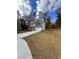 Two-story house with gray brick, white garage door, and landscaping at 2270 Highridge Point Dr, Lithia Springs, GA 30122