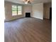 Spacious Gathering room with hardwood floors, fireplace and large window at 2270 Highridge Point Dr, Lithia Springs, GA 30122