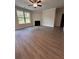 Spacious Gathering room with hardwood floors, fireplace and large window at 2270 Highridge Point Dr, Lithia Springs, GA 30122