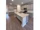 Modern kitchen with gray cabinets, granite counters, and island at 2270 Highridge Point Dr, Lithia Springs, GA 30122