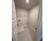 Laundry room with tile floor and built-in shelving at 2270 Highridge Point Dr, Lithia Springs, GA 30122