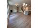 Open concept living room with hardwood floors, fireplace, and kitchen views at 2270 Highridge Point Dr, Lithia Springs, GA 30122