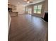 Spacious living room featuring hardwood floors, a fireplace, and access to backyard at 2270 Highridge Point Dr, Lithia Springs, GA 30122