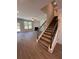 Elegant staircase with dark metal balusters and carpeting at 2270 Highridge Point Dr, Lithia Springs, GA 30122