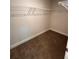 Large walk-in closet with wire shelving and carpeted flooring at 2270 Highridge Point Dr, Lithia Springs, GA 30122