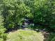 House nestled in a wooded area, with a visible swimming pool at 731 Bolton Nw Rd, Atlanta, GA 30331