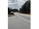 Residential road with trees and a mailbox at 806 Auburn Rd, Auburn, GA 30011