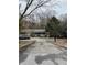 Ranch style home with carport and mature trees at 806 Auburn Rd, Auburn, GA 30011