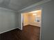 Bright dining room features dark hardwood floors and a modern chandelier at 767 Vinson Sw Pl, Atlanta, GA 30315