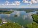 Aerial view of lakefront property with boat docks and lush landscape at 7 Yachting Way, Acworth, GA 30102