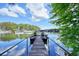 Wooden dock with chairs overlooking a lake marina at 7 Yachting Way, Acworth, GA 30102