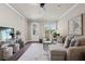 Bright living room featuring a sectional sofa and large window at 5158 Noble Village Way # 35, Lilburn, GA 30047