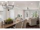 Bright dining room with hardwood floors and a chandelier at 5158 Noble Village Way # 35, Lilburn, GA 30047