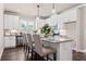 Modern kitchen with white cabinets, granite countertops, and stainless steel appliances at 5158 Noble Village Way # 35, Lilburn, GA 30047